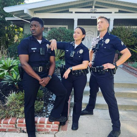 Melissa O'Neil with the cast of The Rookie.